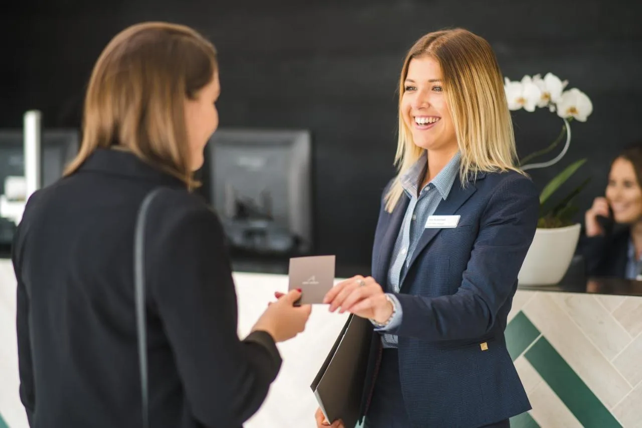 two women standing in an office shaking hands at Apex City of Bath Hotel in Bath